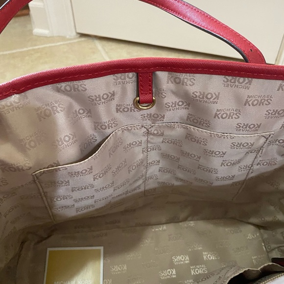 Michael Kors cherry red purse. VGUC, multiple pockets to neatly carry items. - Picture 9 of 13